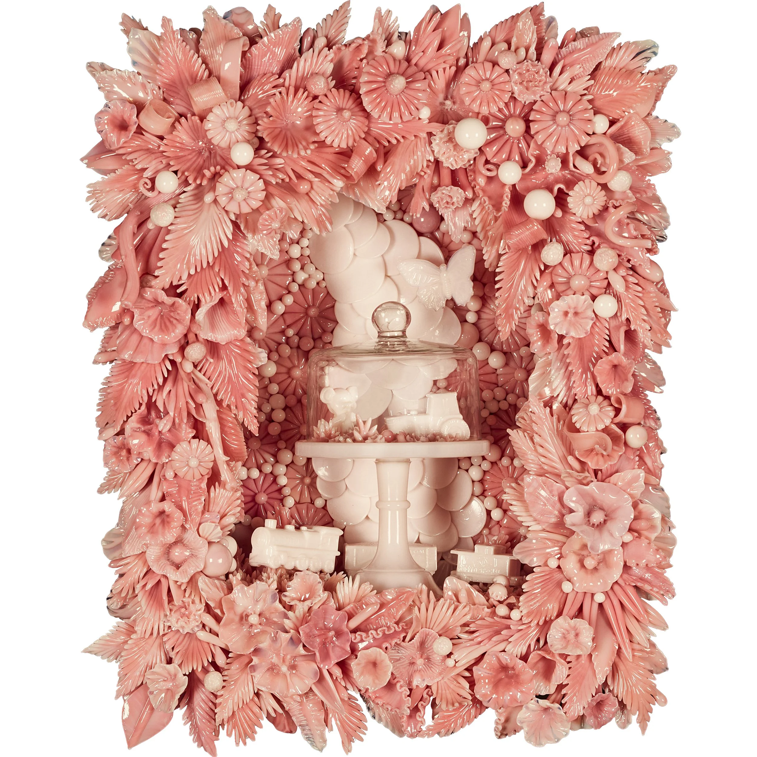 Pink glass sculpture of leaves and flowers spreading out from a small cake stand in the center.