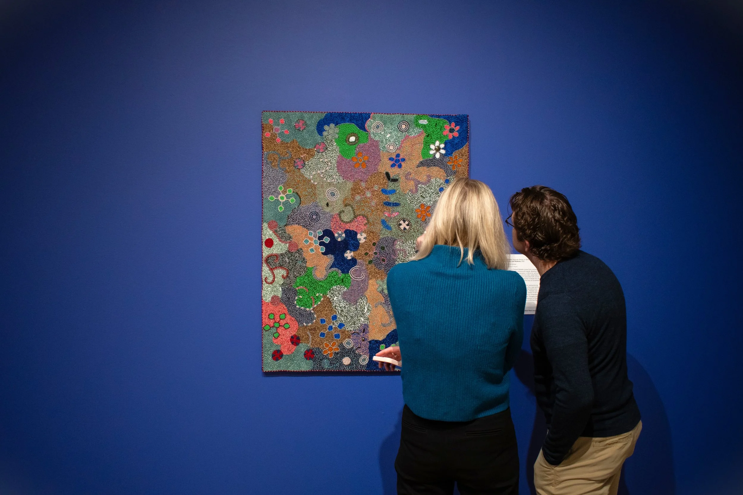 Two adults studying an artwork.jpg