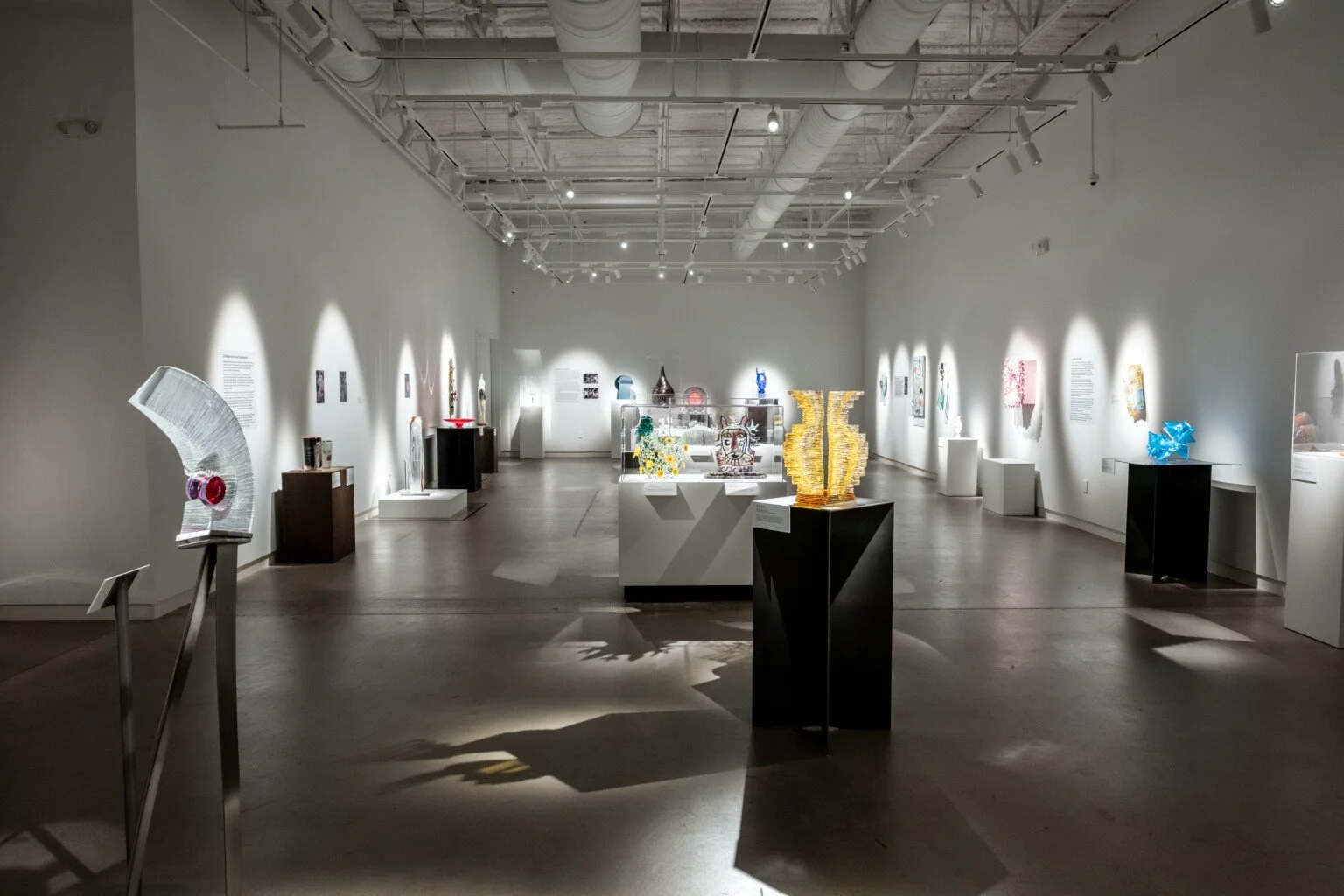 A gallery view depicting many different glass sculptures.