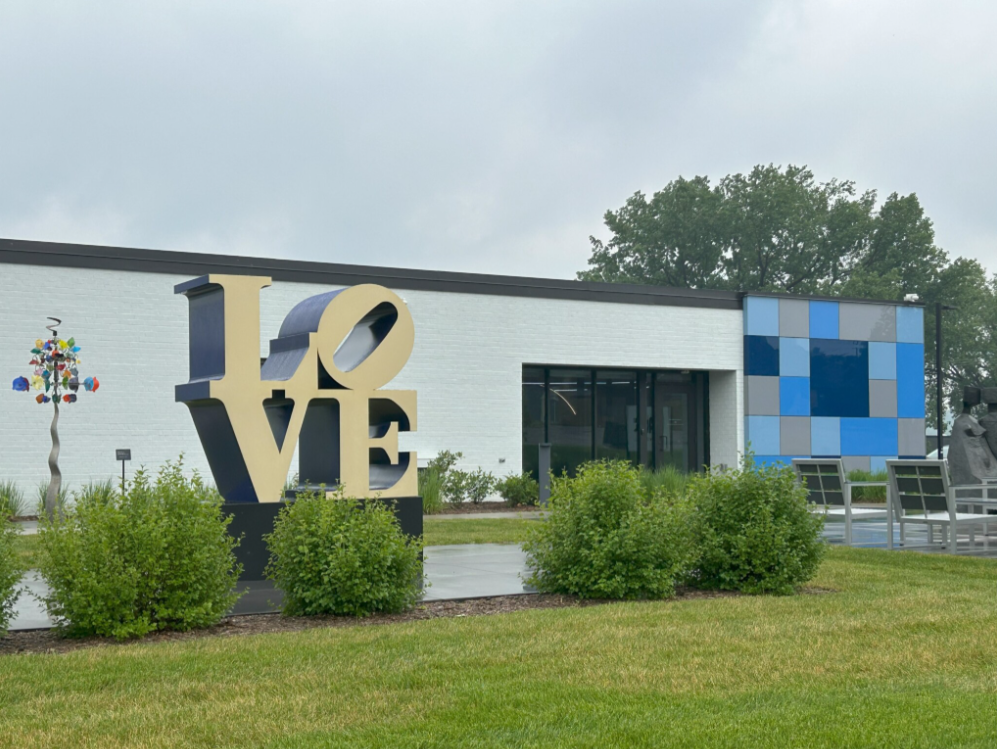 Robert Indiana's iconic LOVE sculpture on the museum patio on a drizzly gray day.