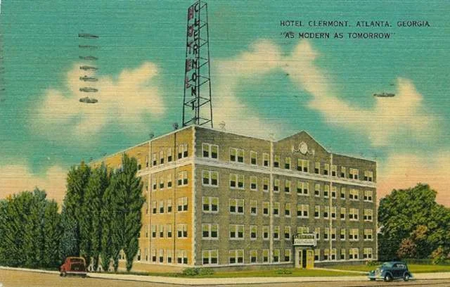 An illustration of the Hotel Clermont in Atlanta, Georgia, showcasing its modern design, with a prominent vertical sign and a few cars parked in front, and trees lining the street.