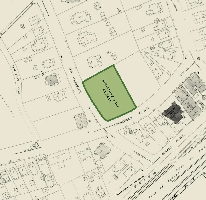 Map showing a highlighted green area labeled 'Miniature Golf Course' located between Edgewood Ave N.E. and Elizabeth N.E., with surrounding residential buildings and streets, including Park Lane N.E., DeKalb Ave N.E., and a railway track.