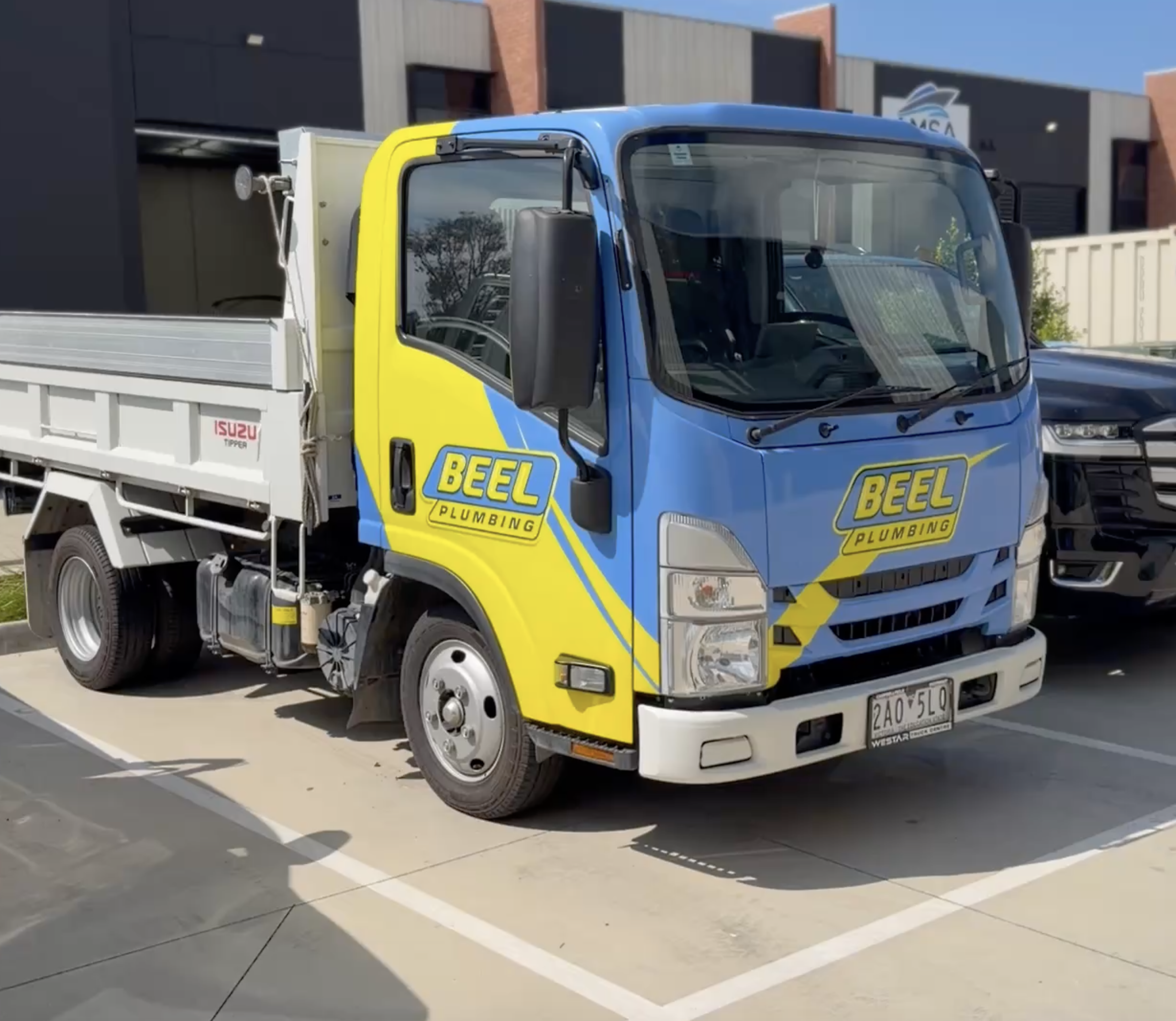Blue and yellow service truck