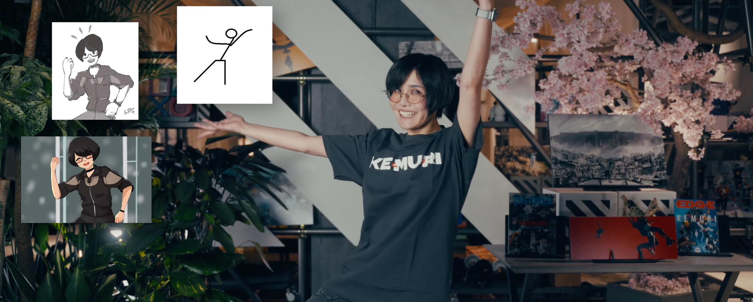 A woman with short black hair, glasses, and a black T-shirt smiling with arms raised in a modern indoor space decorated with pink cherry blossom trees and framed artwork, surrounded by plants and books.