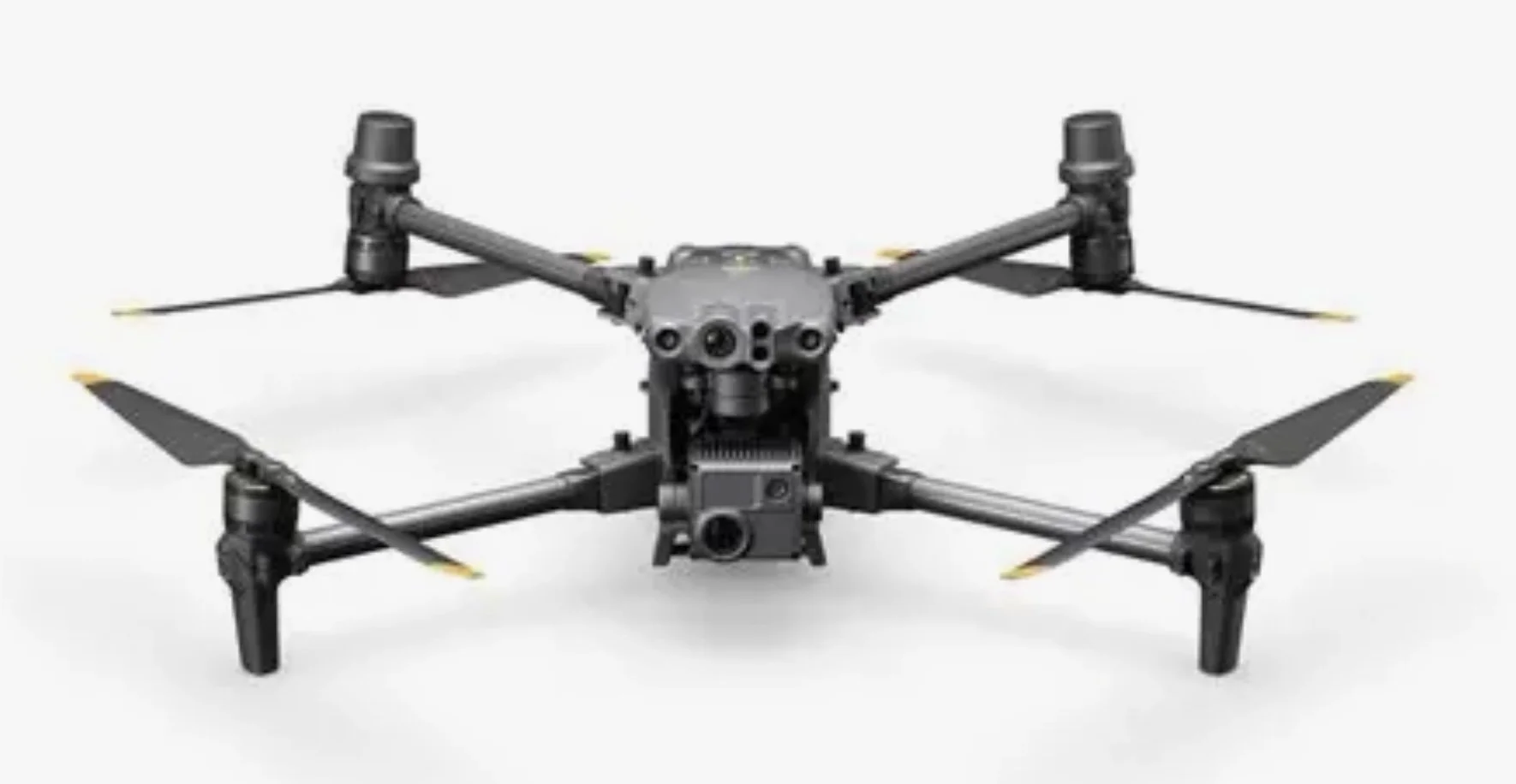 A black quadcopter drone with four propellers and a camera mount at the front.