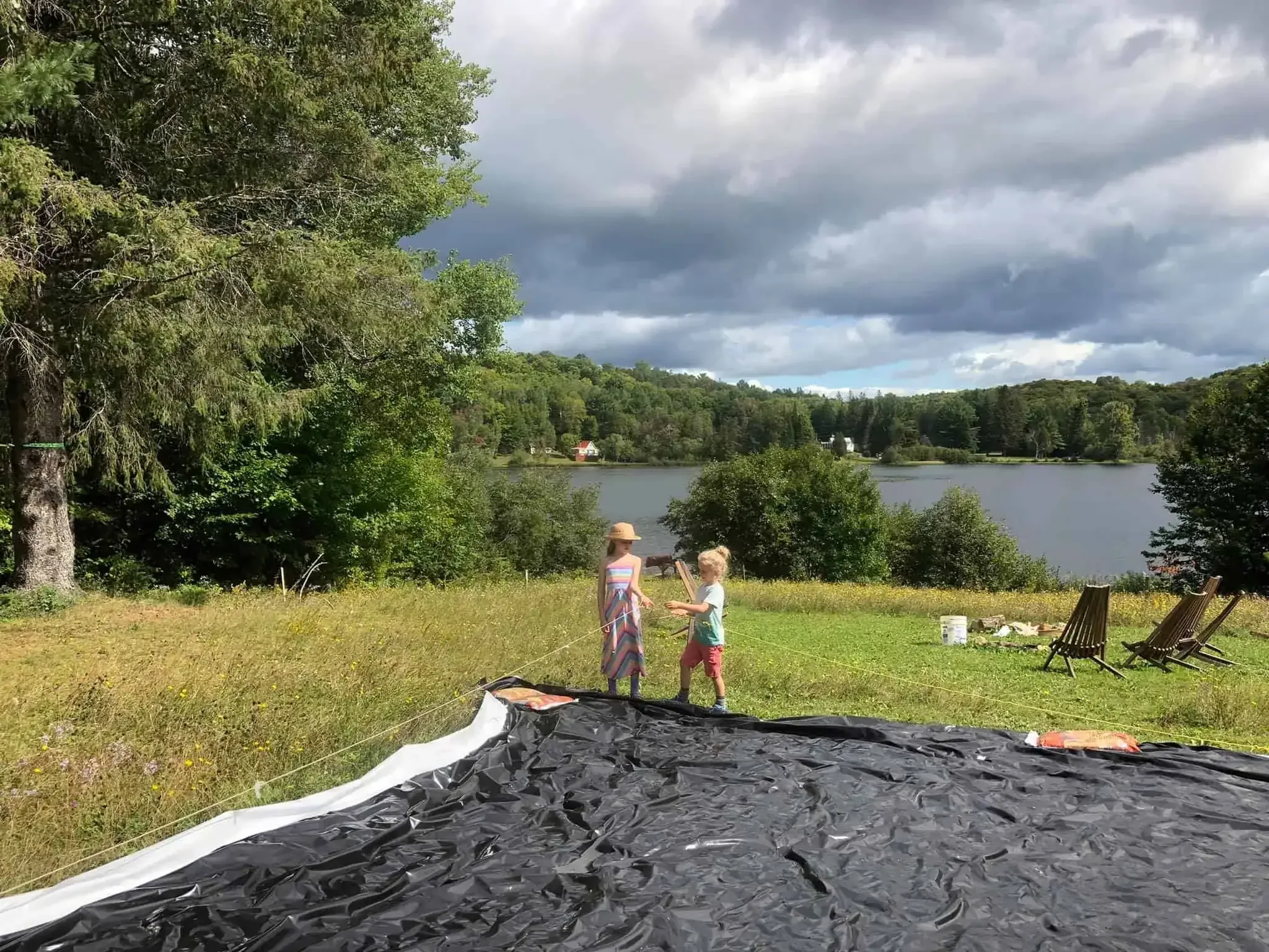 Children helping set out sillage tarp
