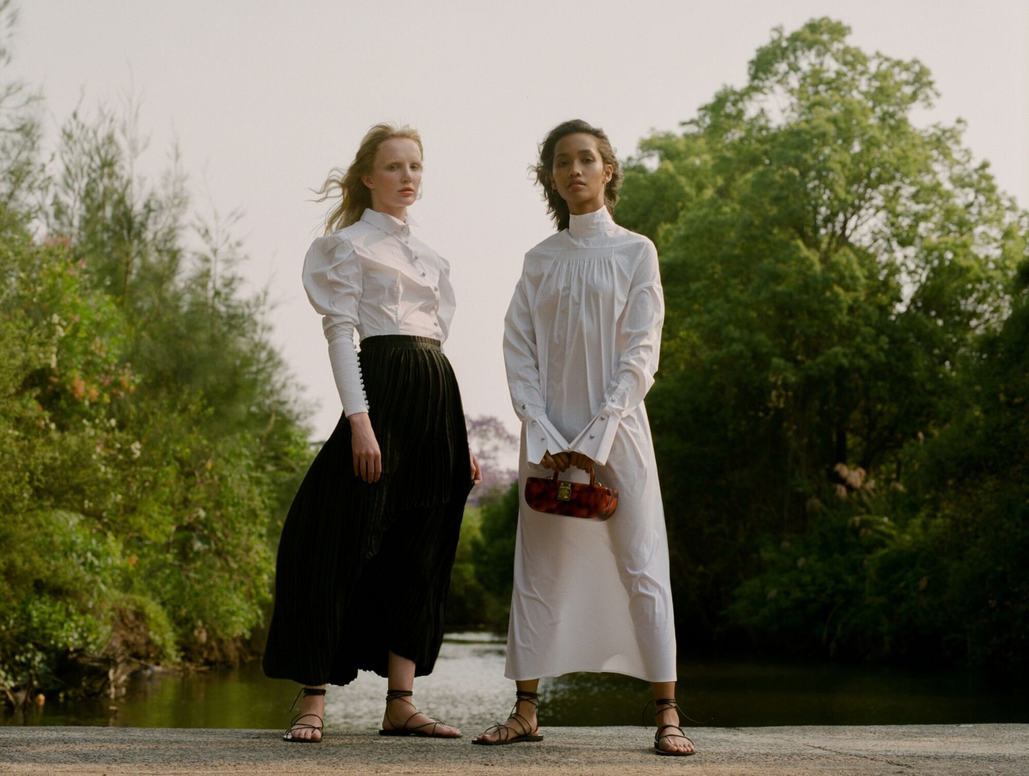 Khai wears Leo and Lin dress, Sans Beast clutch @sans.beast, Maria Farro sandals @mariafarrofootwear // Zhon wears Leo &amp; Lin shirt, Pleats Please by Issey Miyake skirt @pleatspleaseisseymiyake, Maria Farro sandals @mariafarrofootwear