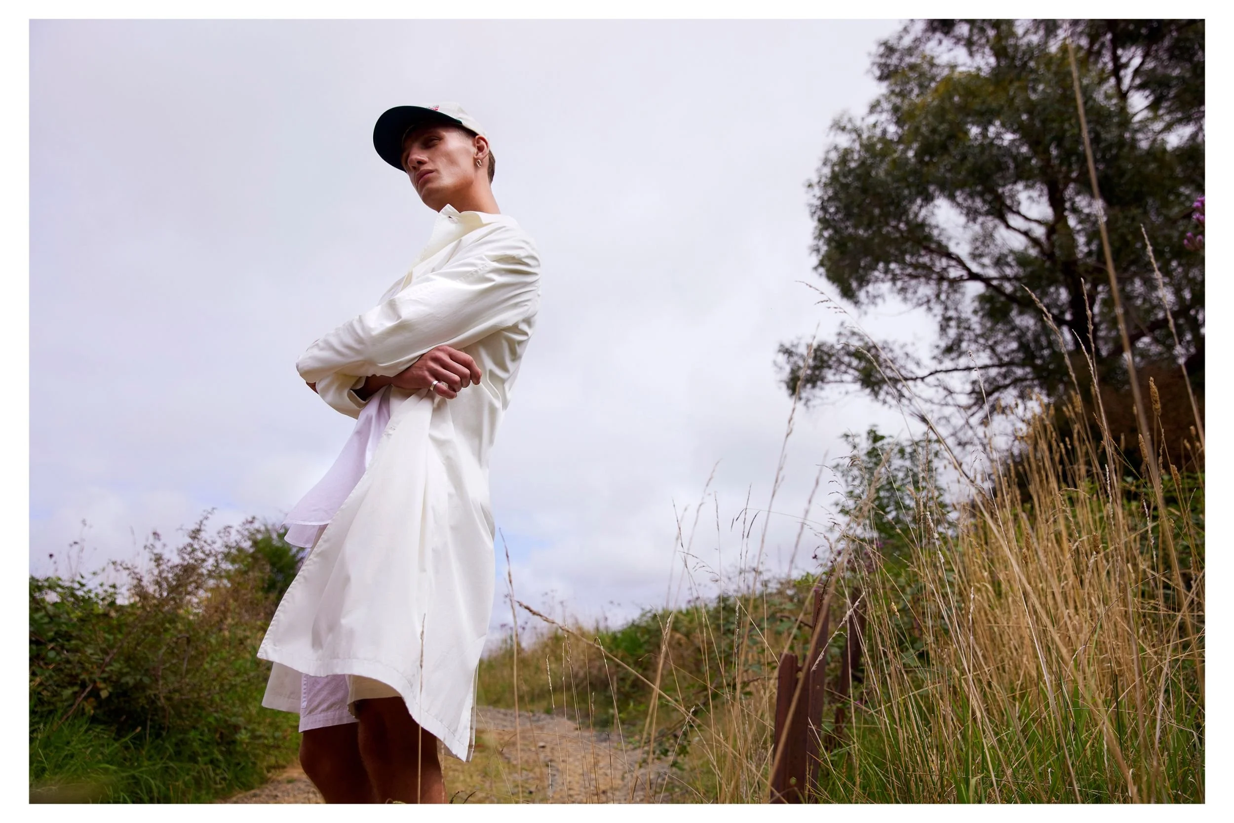   Emporio Armani trench coat. Cos shirt and shorts. Vintage cap. Never Never   
