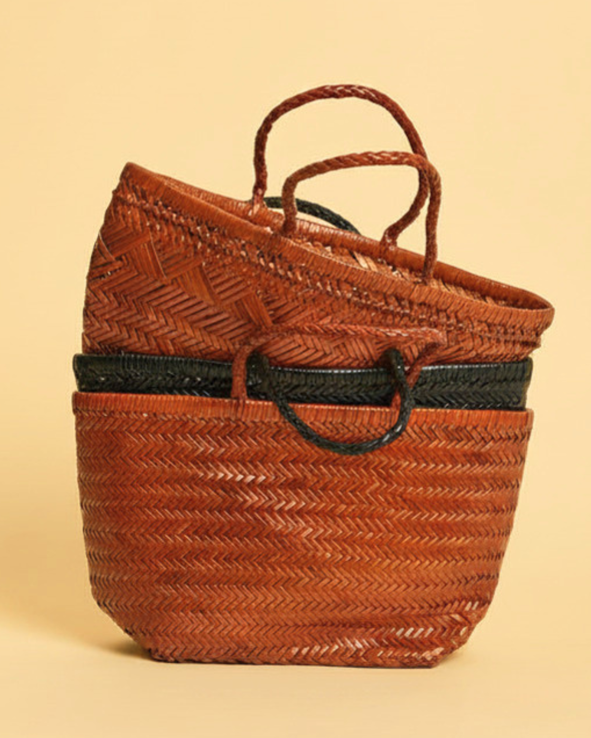 Tan and black woven leather bags by Tesori Studios