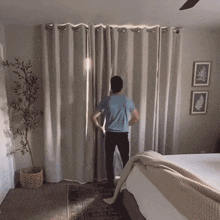 A moving gif showing a man throwing open some curtains.