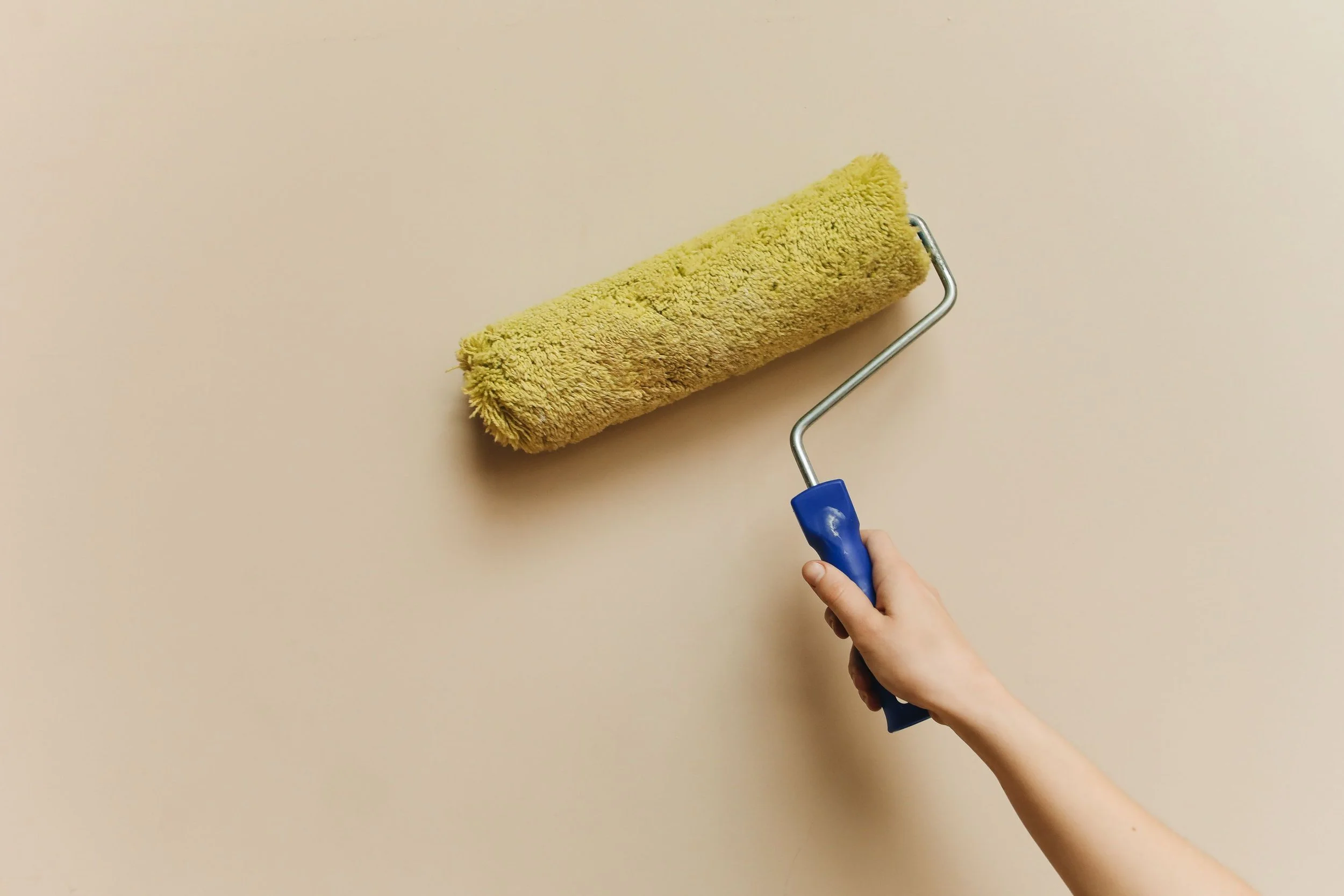 a paint roller on a wall