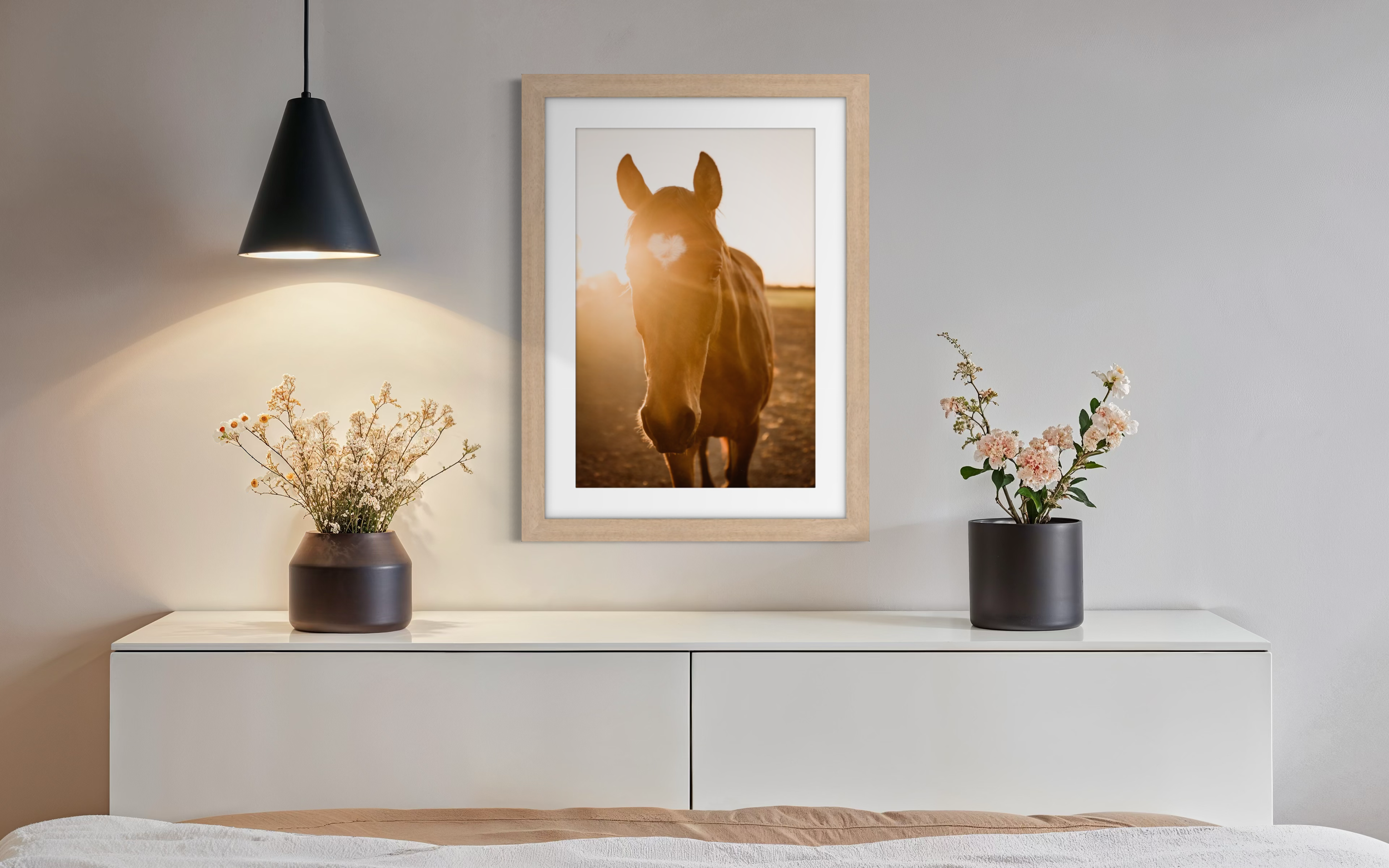 Framed fine art horse photograph displayed in a styled interior.