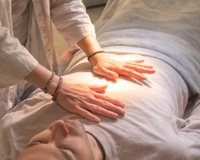 Our practitioner doing Energy Balancing work on a client to clear blockages and restore balance