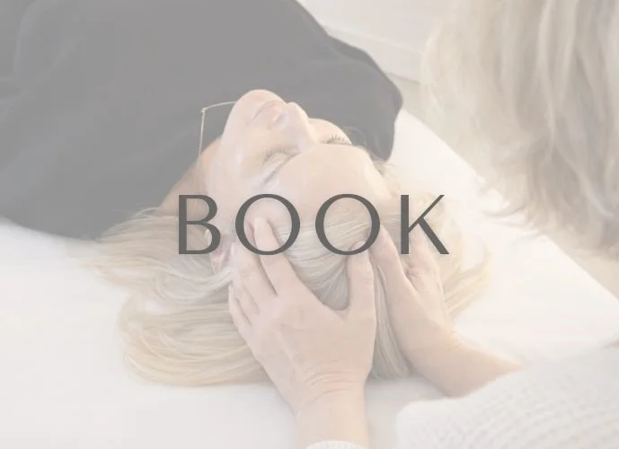 Practitioner doing therapeutic somatic work on patient to support alignment, release tension