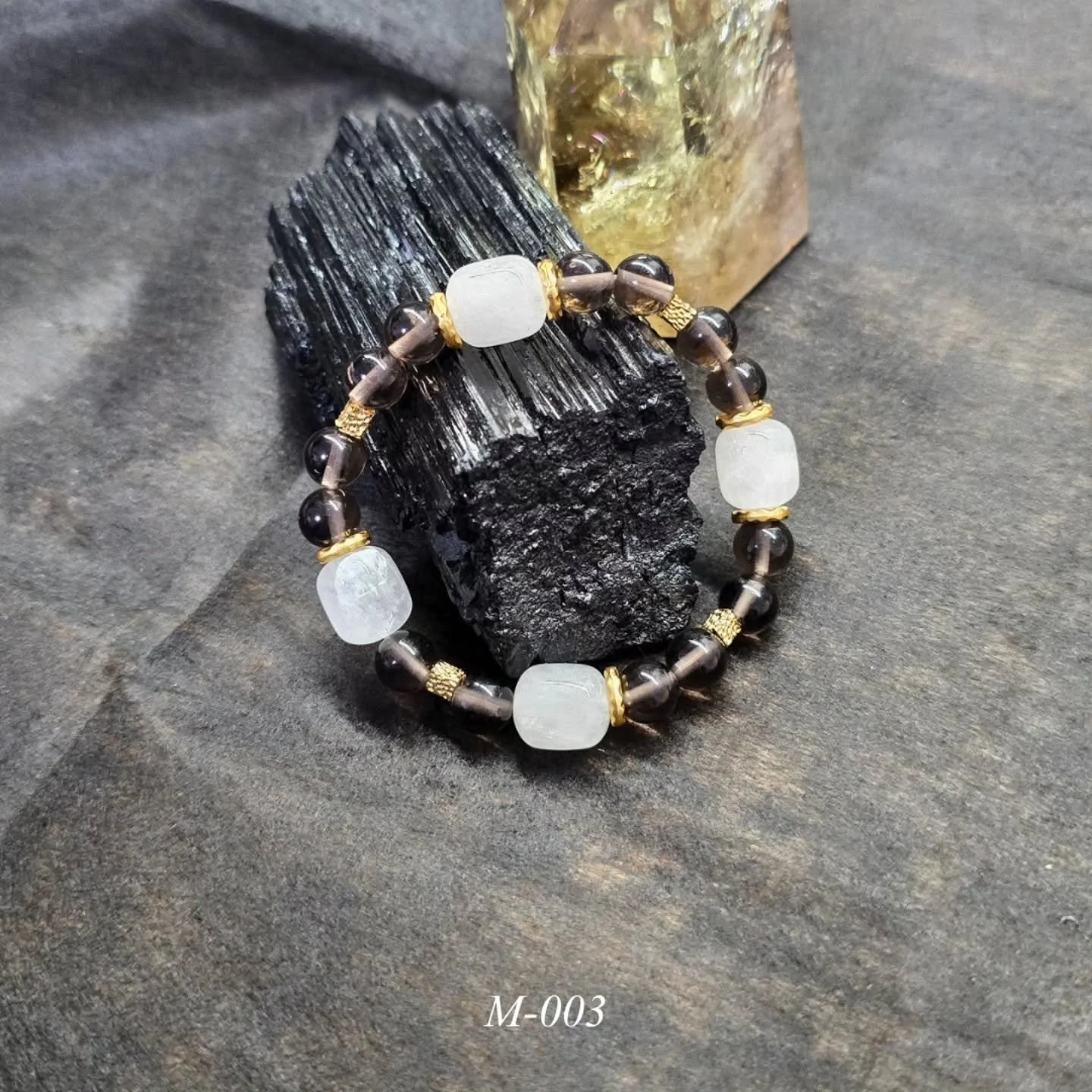 Smoky quartz &amp; White phantom quartz

Fits 15-16cm wrist size, custom resizing available.

Minimal stones. Quietly worn.

#wearabledepth #handmadebracelet #minimaljewelry #crystalbracelet #naturalstonebracelet