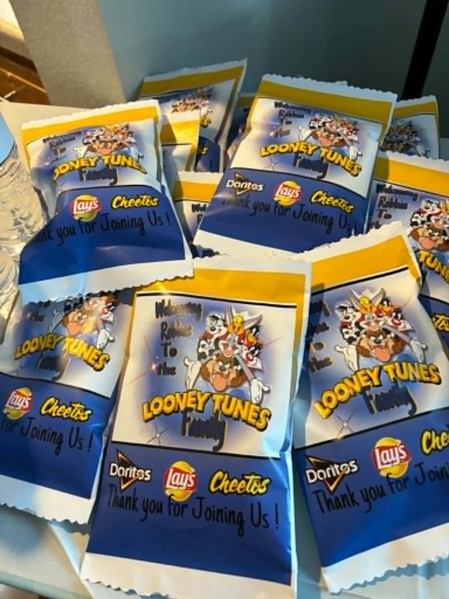Multiple McDonald's snack bags with Looney Tunes characters, the Lay's logo, and the text 'Cookies' on each, thanking customers for joining.