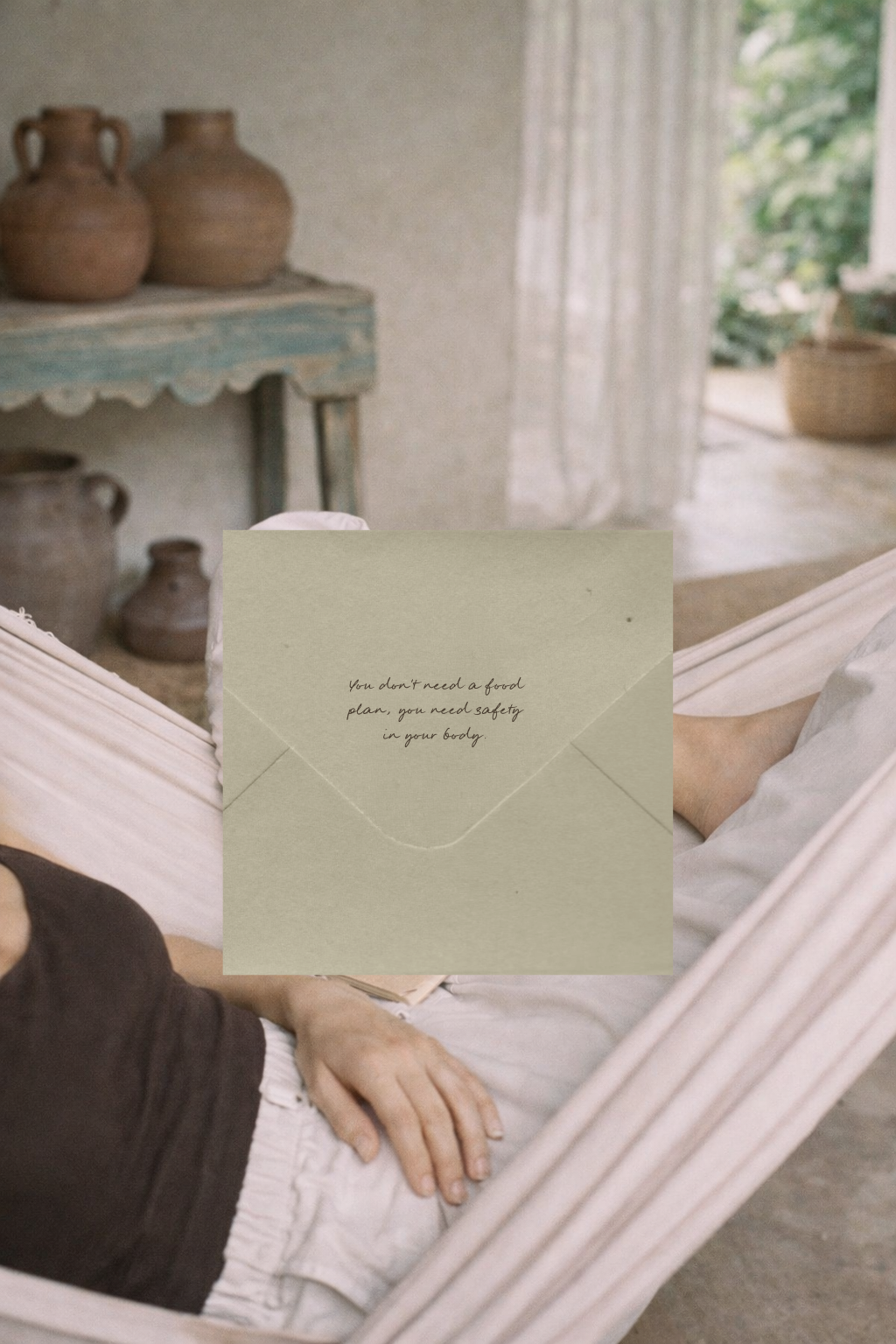 Person relaxing in a hammock with a green envelope that has handwritten text "you don't need a food plan you need safety in your body" in a room with rustic terracotta vases and natural light.