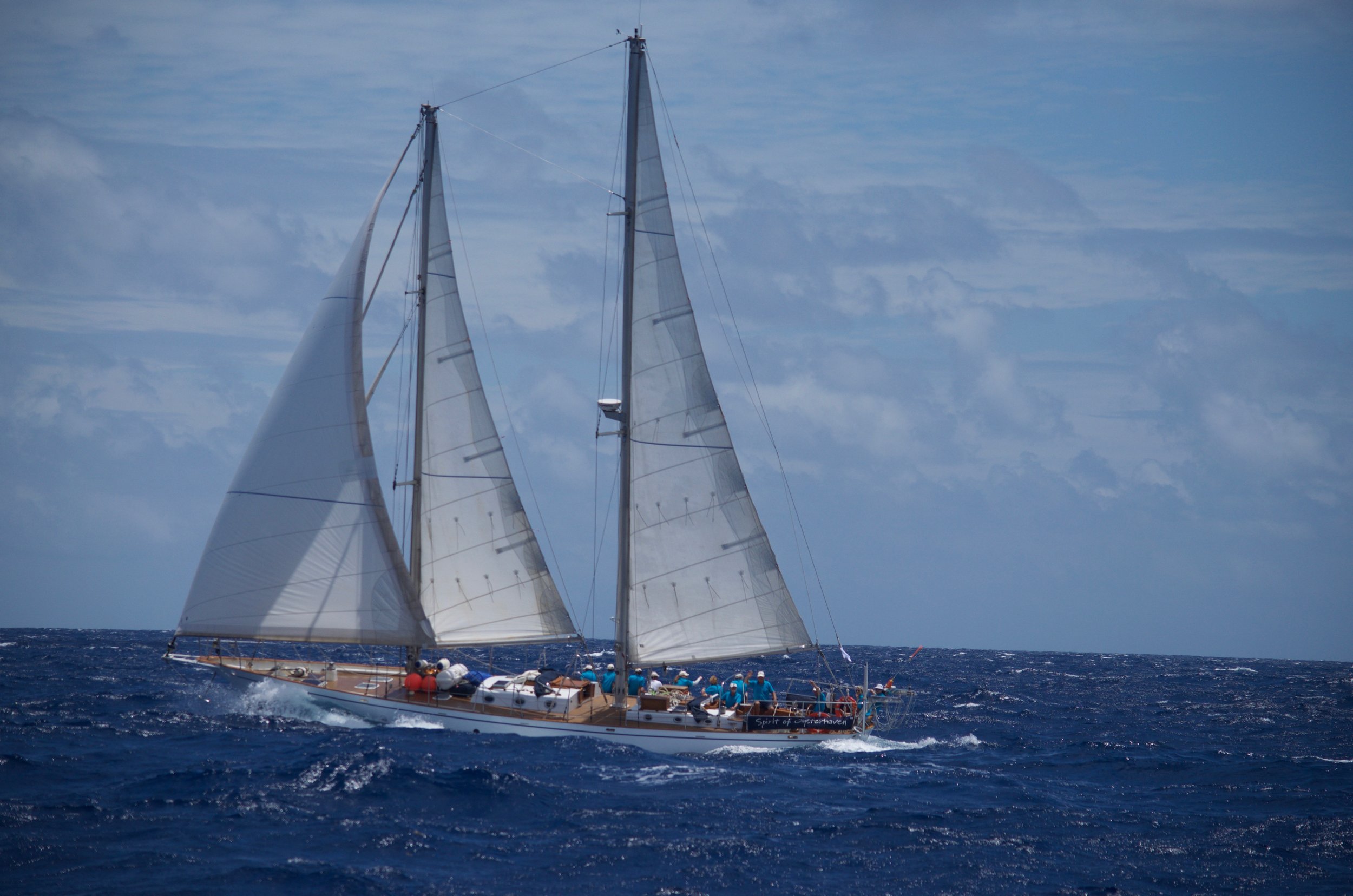 Aerial view of the classic schooner Spirit of Ostend sailing in open Atlantic waters.