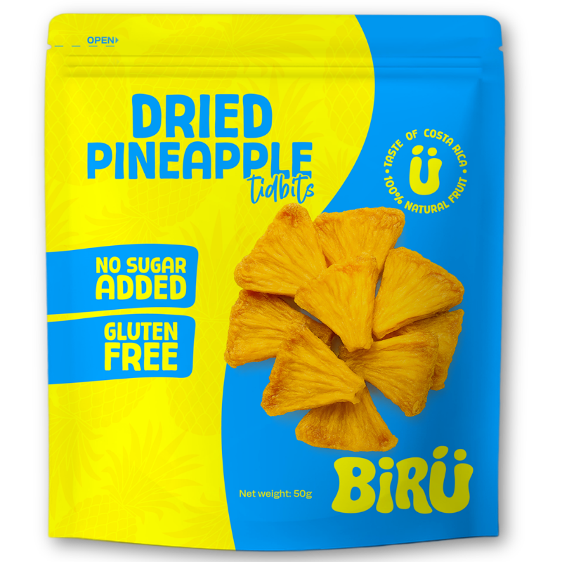 Bright yellow and blue packaging with dried pineapple tidbits in the center. The label states 'Dried Pineapple Tidbits' with additional notes indicating 'No Sugar Added' and 'Gluten Free'.
