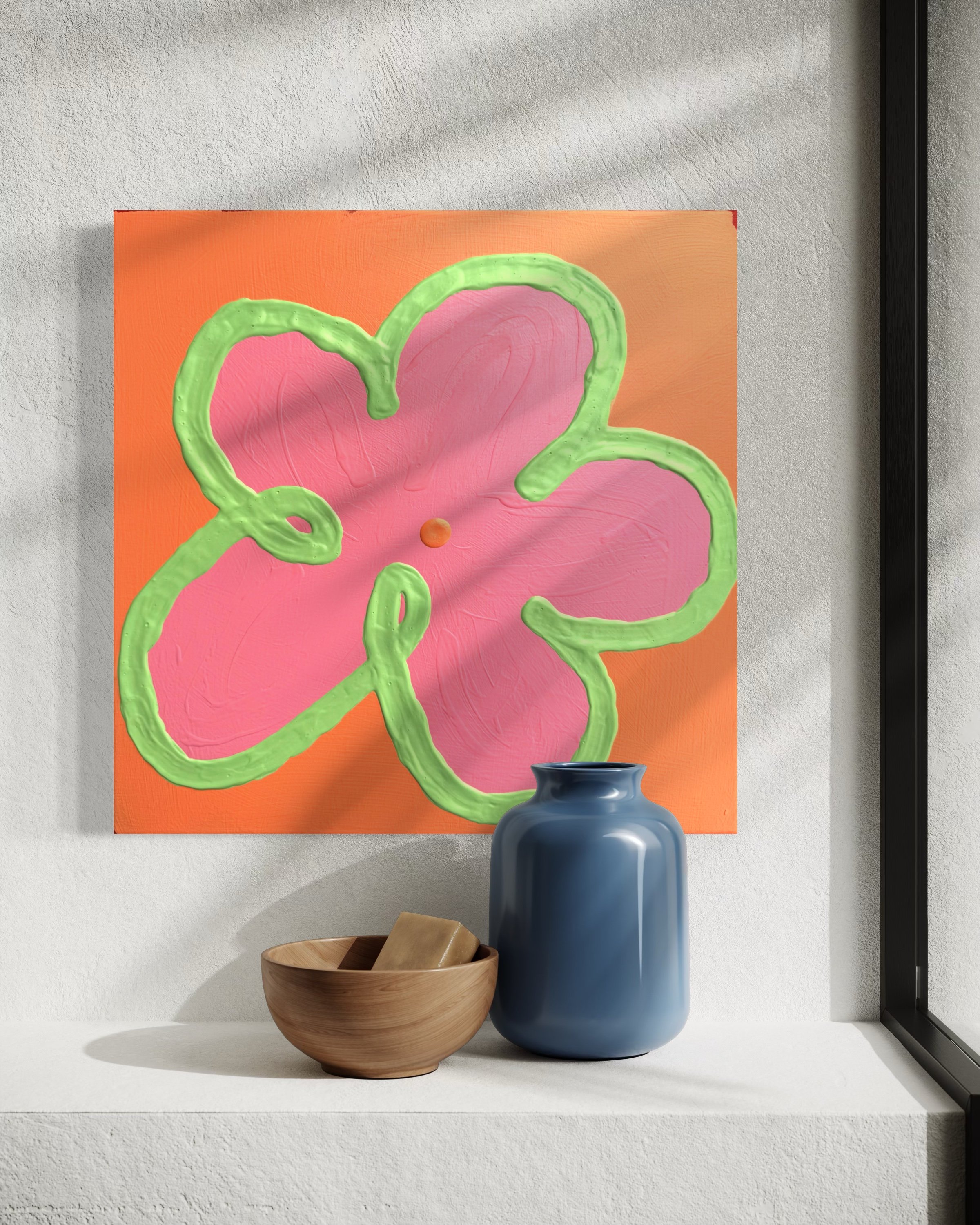 A still life composition of a blue vase, a wooden bowl with a spoon, and a dark cup, arranged on a white surface under a colorful abstract painting featuring pink flowers with green outlines on a peach background.