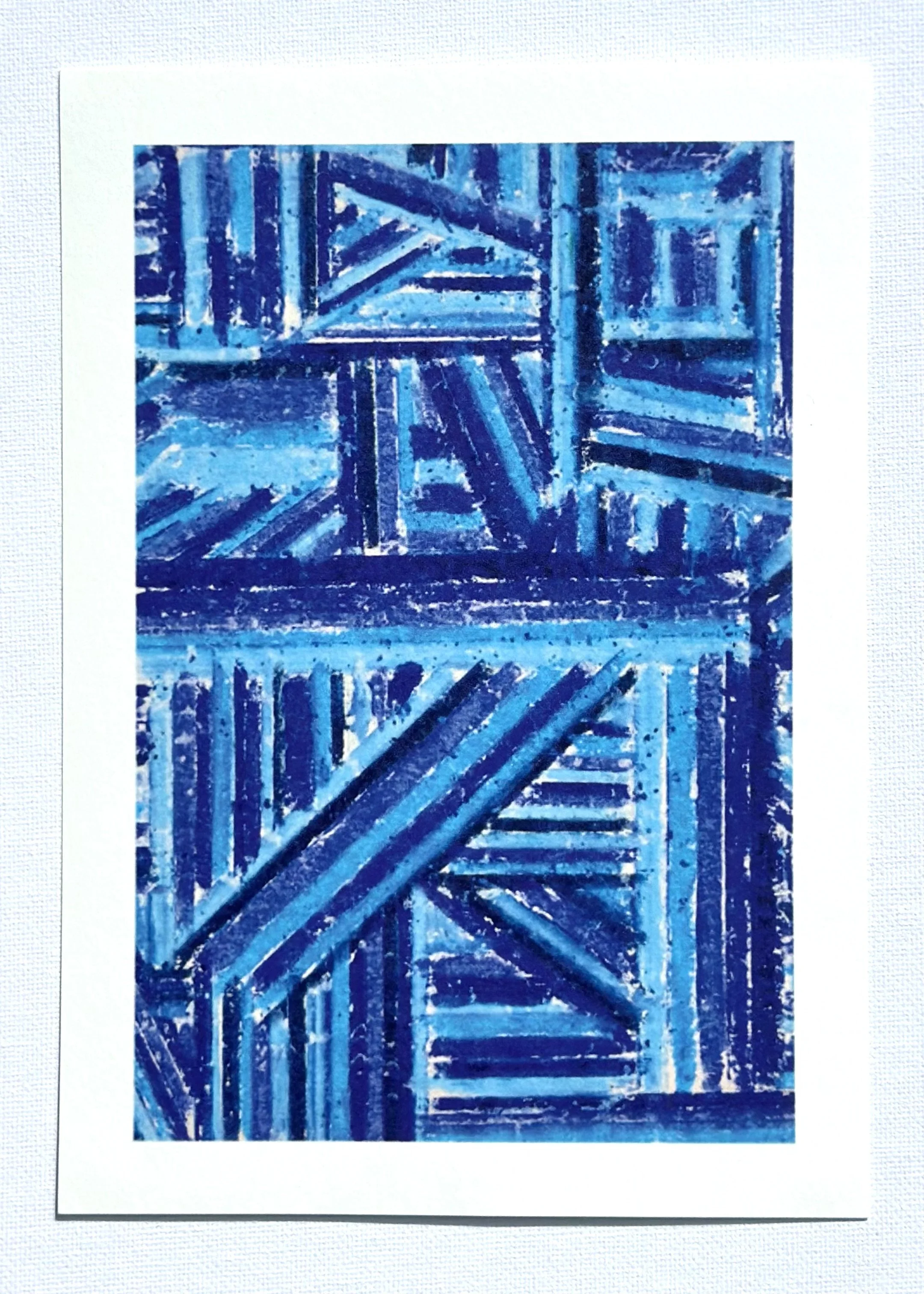 A blue abstract painting with geometric patterns and textured brushstrokes.
