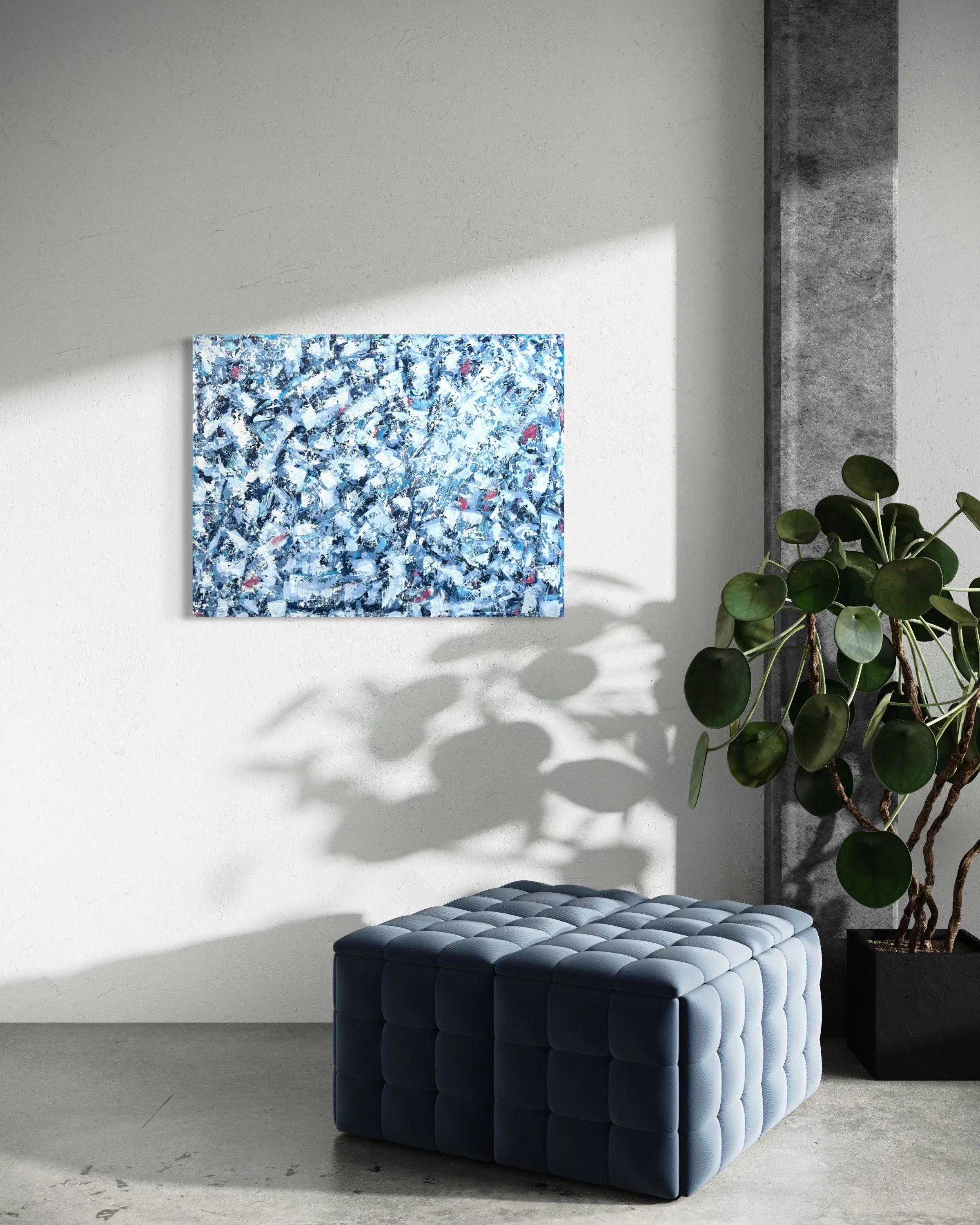 Modern interior with a white textured wall, abstract blue painting, green houseplant, tufted dark blue ottoman, and a black side table.