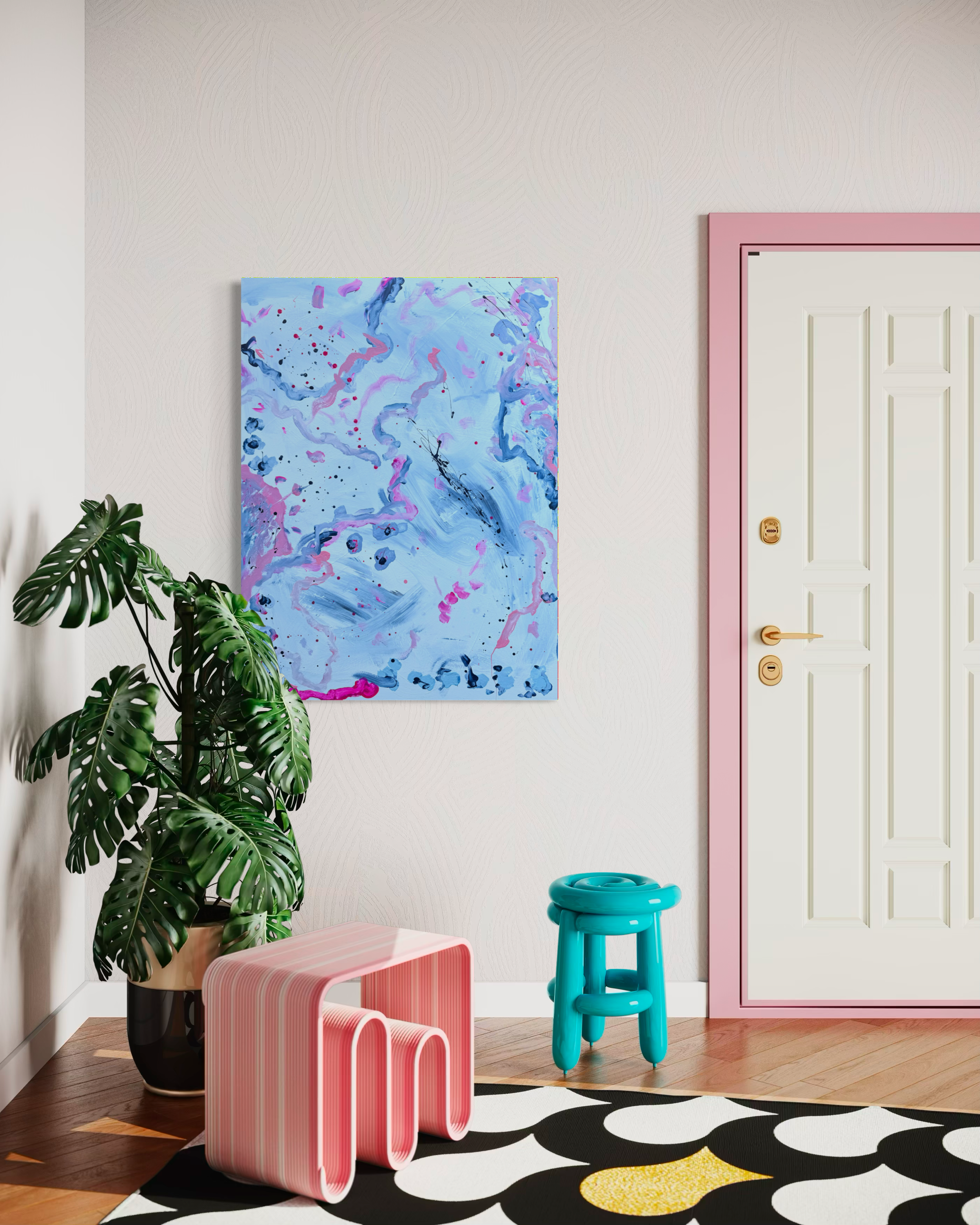 A colorful modern interior room features a large abstract painting with pink, blue, and black paint splatters and swirls on the wall, a large leafy potted Monstera plant, and bright pink and turquoise stools on a black and white patterned rug with yellow accents, pink door trim, and a white door.