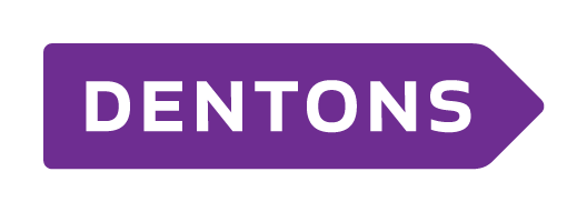 Purple arrow-shaped sign with white text reading 'DENTONS'.