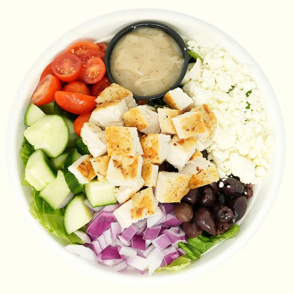Taverna Chicken - All natural chicken, romaine lettuce, cucumber, Kalamata olives, red onion, tomato, feta cheese, served with Mediterranean red wine dressing.