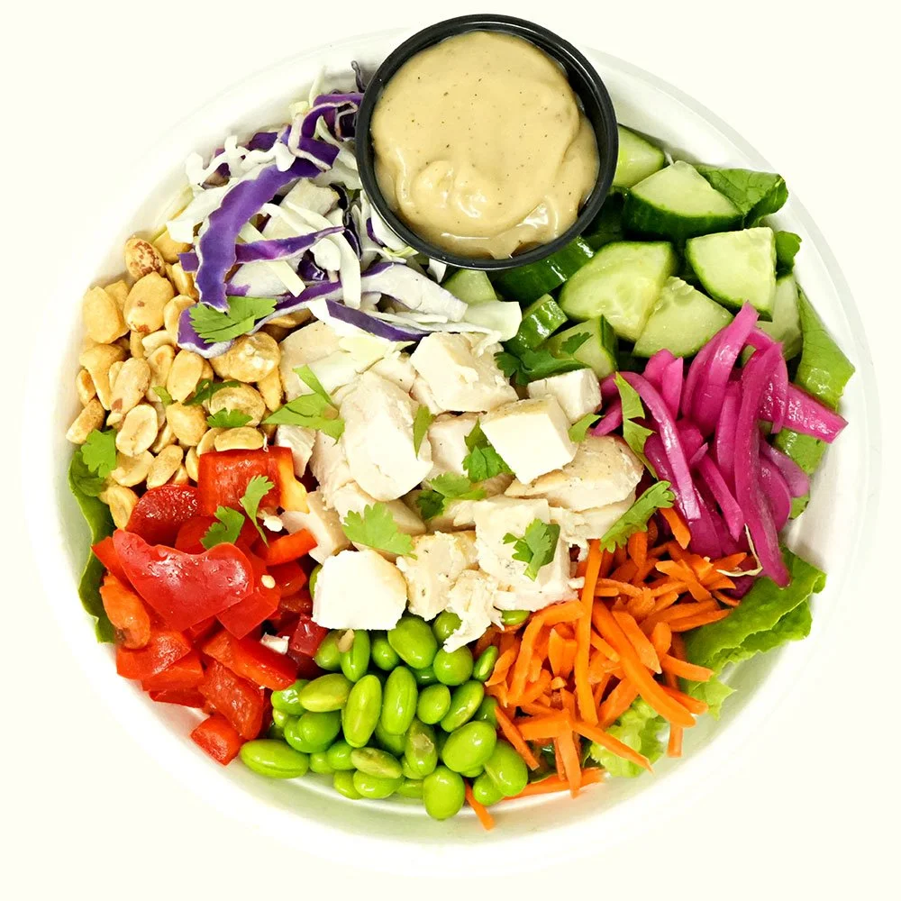 Asian Chicken - All natural chicken, romaine, cabbage, edamame, pickled onions and carrots, cucumber, bell pepper, cilantro, peanuts, Asian sesame ginger dressing.