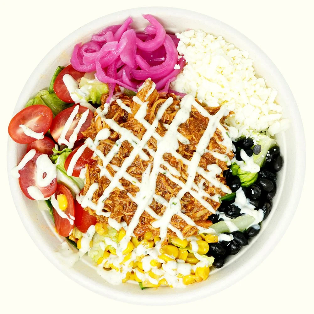 BBQ Chicken - Romaine lettuce, black beans, roasted corn, tomato, pickled onion, cotija cheese, shredded bbq chicken, served with ranch dressing.