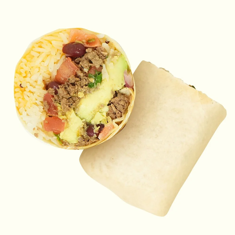 Ranchero Burrito - Seasoned grass-fed ground beef, pico de gallo, rice, kidney beans, cheese blend, avocado with a Baja ranch drizzle in a flour wrap. Contains Gluten