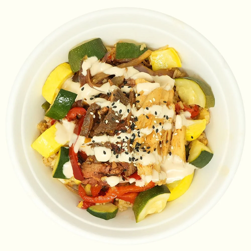 Steak & Chicken - Marinated grass-fed steak,
all natural chicken, stir-fry vegetables, sesame seeds, served over hibachi rice with a ‘yum-yum’ drizzle.