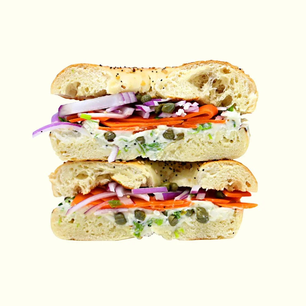 Smoked “Lox” Bagel - Smoked carrots, red onion, capers, scallion infused cream cheese on an everything bagel. Contains Gluten