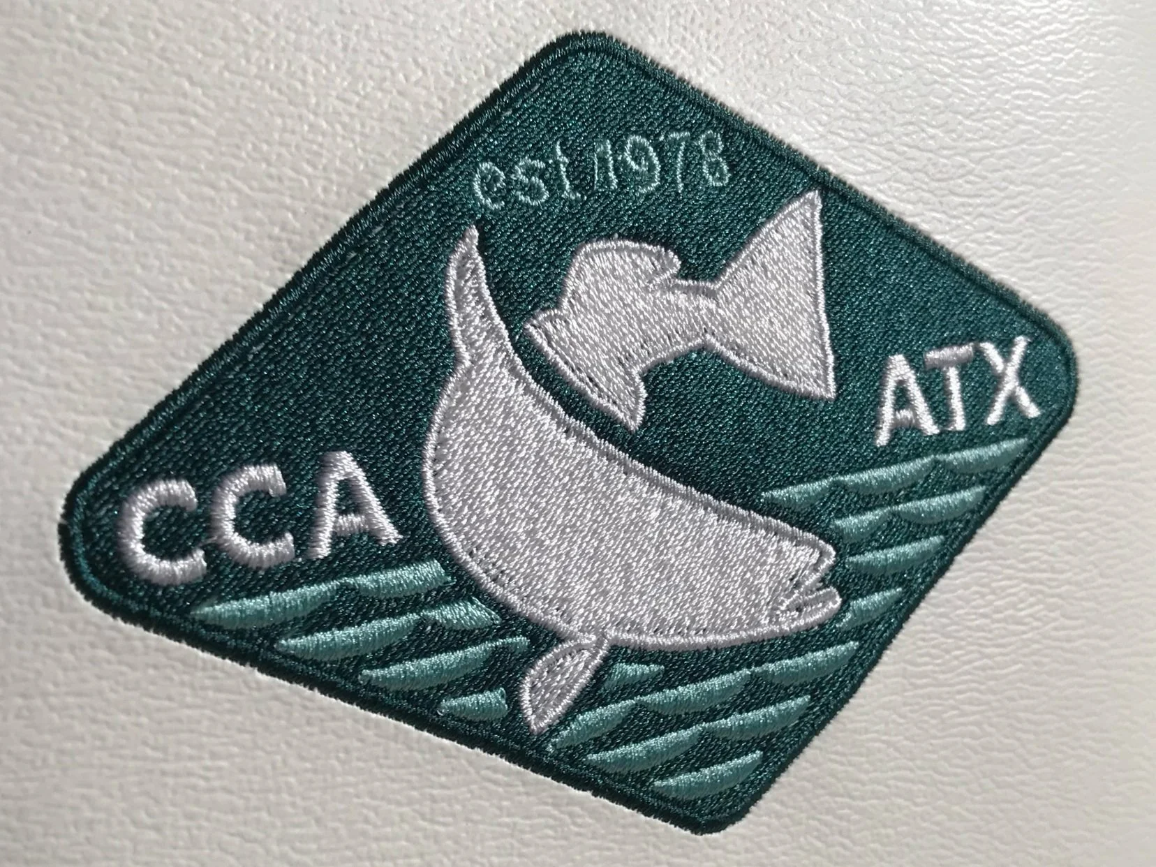 The banquet logo can be found adorning all manner of ancillary items around the hall. In this case the secondary logo was embroidered in the seats of a golf cart to be raffled off.