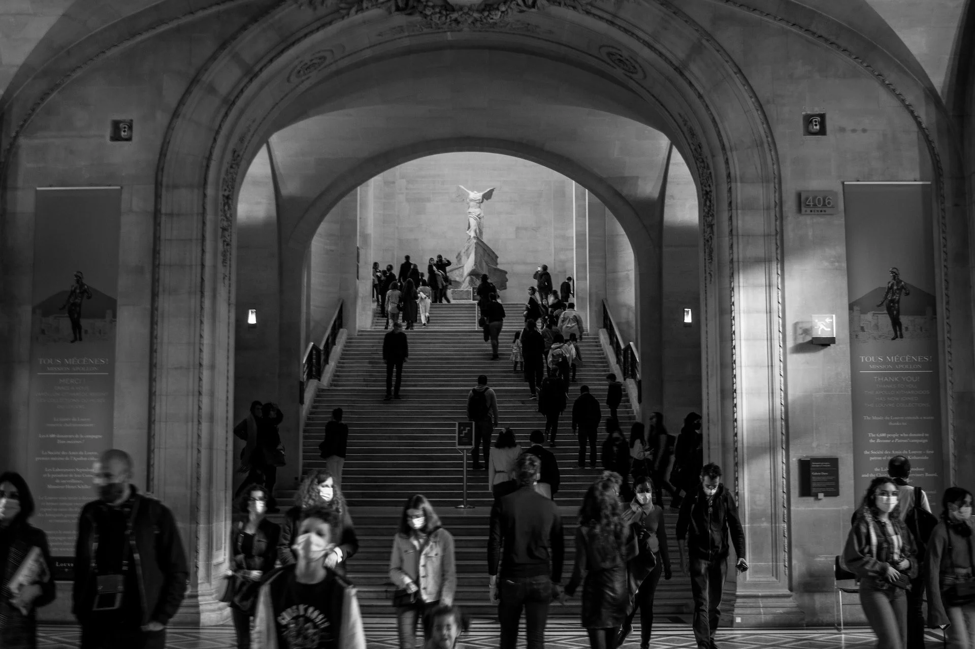 Custom Squarespace Template, Editorial Squarespace Template, Avelã Creative. People walking inside a grand hallway with stairs and a sculpture at the top.