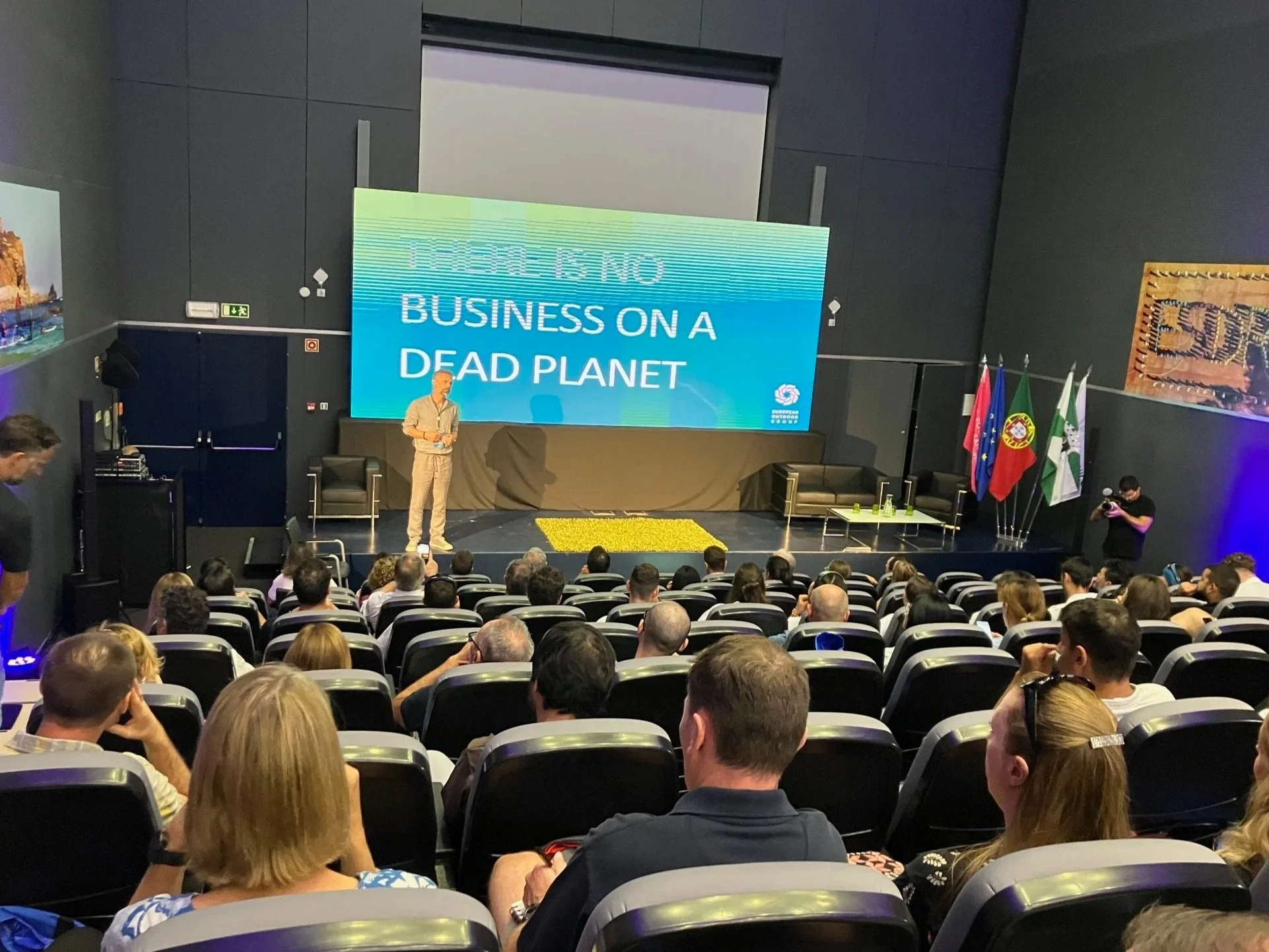 Christian Schneidermeier speaking at a conference on regenerative leadership and economy