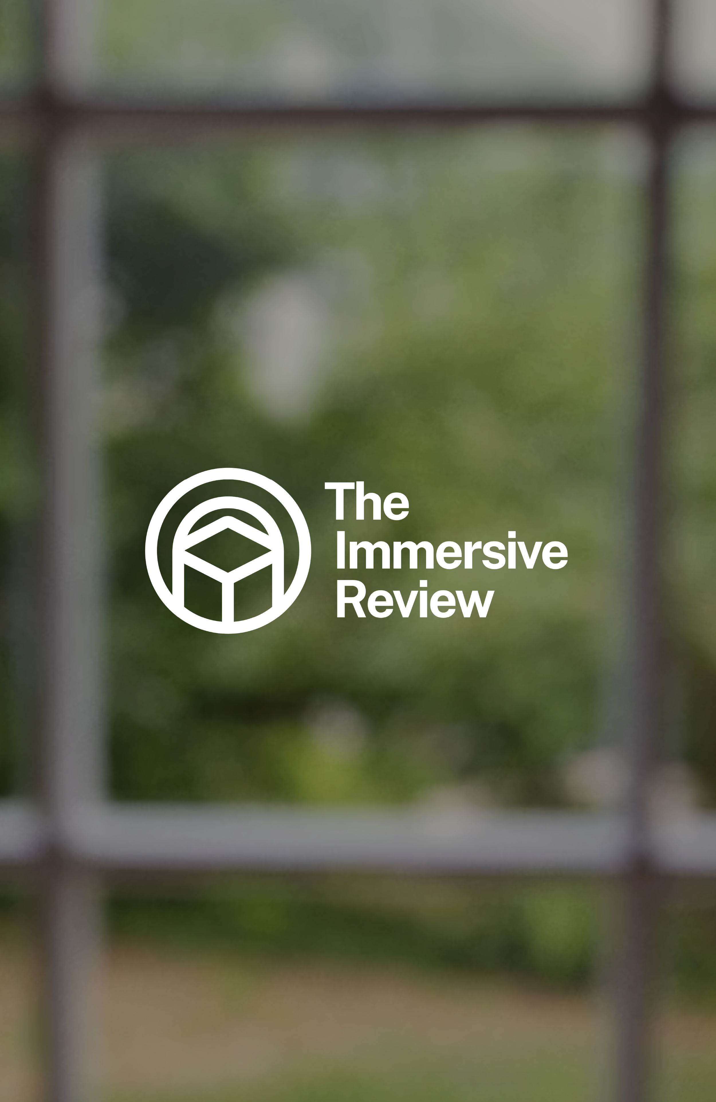 A blurred view of a window with a logo and text overlay that reads 'The Immersive Review'.