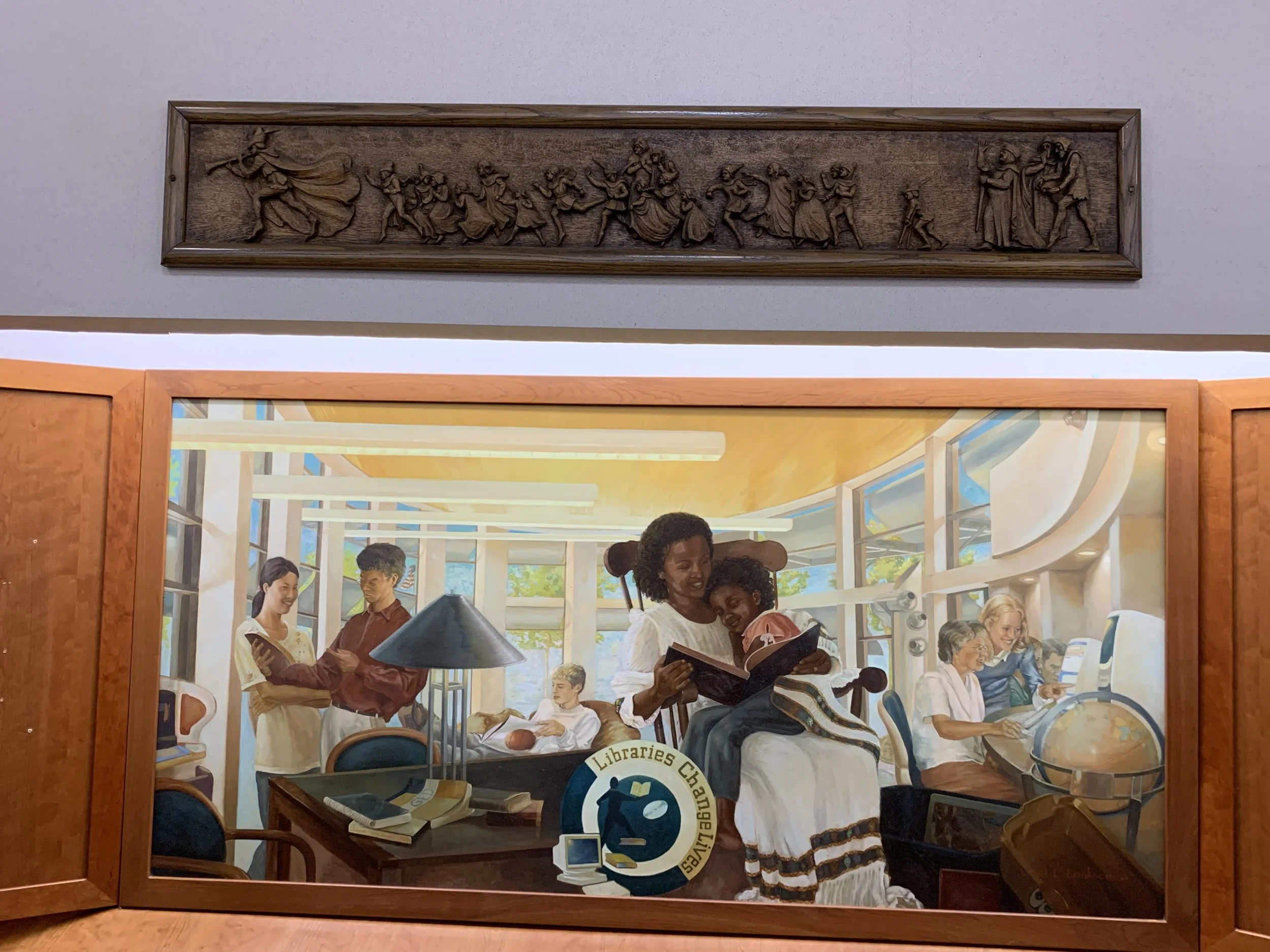 The Pied Piper mantelpiece from the Fireside Room in the Crawford Library is now above the Foundation's mural outside the Friends Bookstore.