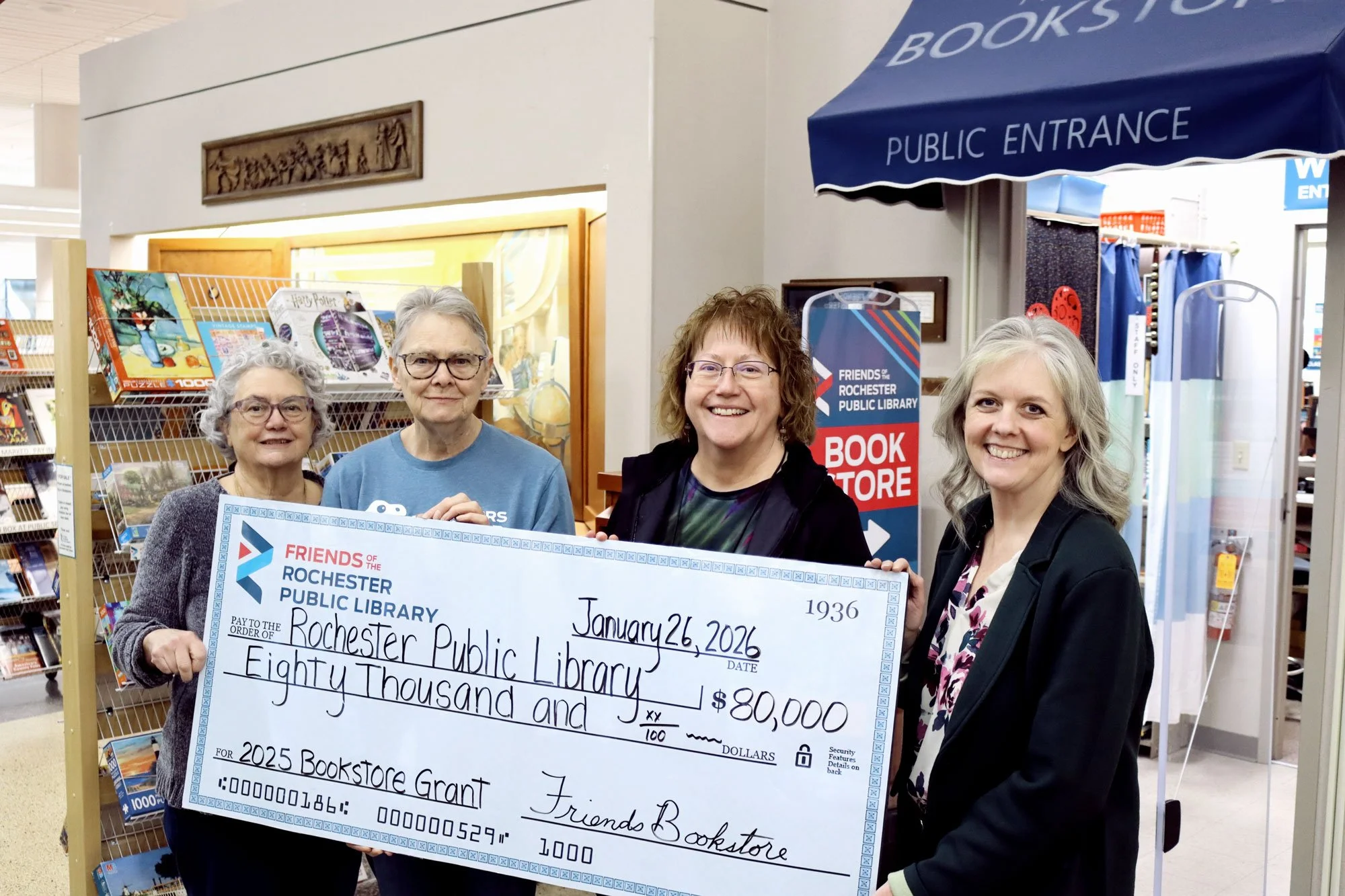 The Friends Bookstore presented the library with a check for $80,000 from 2025 store profits.