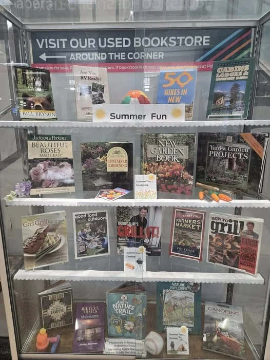 Check out the glass display case with themed merchandise next to the staircase just inside the library entrance.