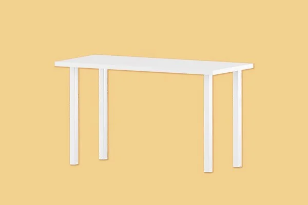 White table against a beige background