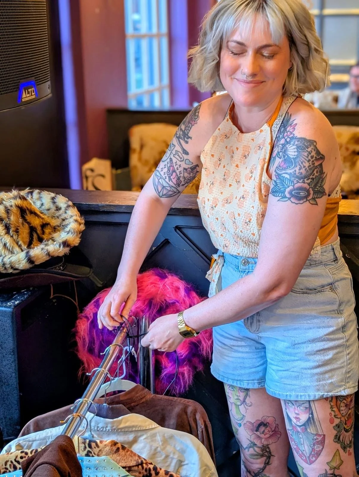 Louise Kehoe helping organise vintage clothing and styling props behind the scenes at the Dazzle Dance event, supporting the setup and delivery of the event.