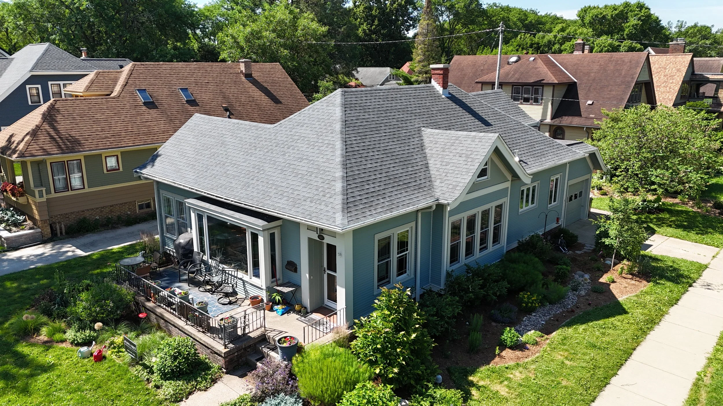 Completed GAF Natural Shadow Pewter Gray shingle roof on a residential home, photographed from above.