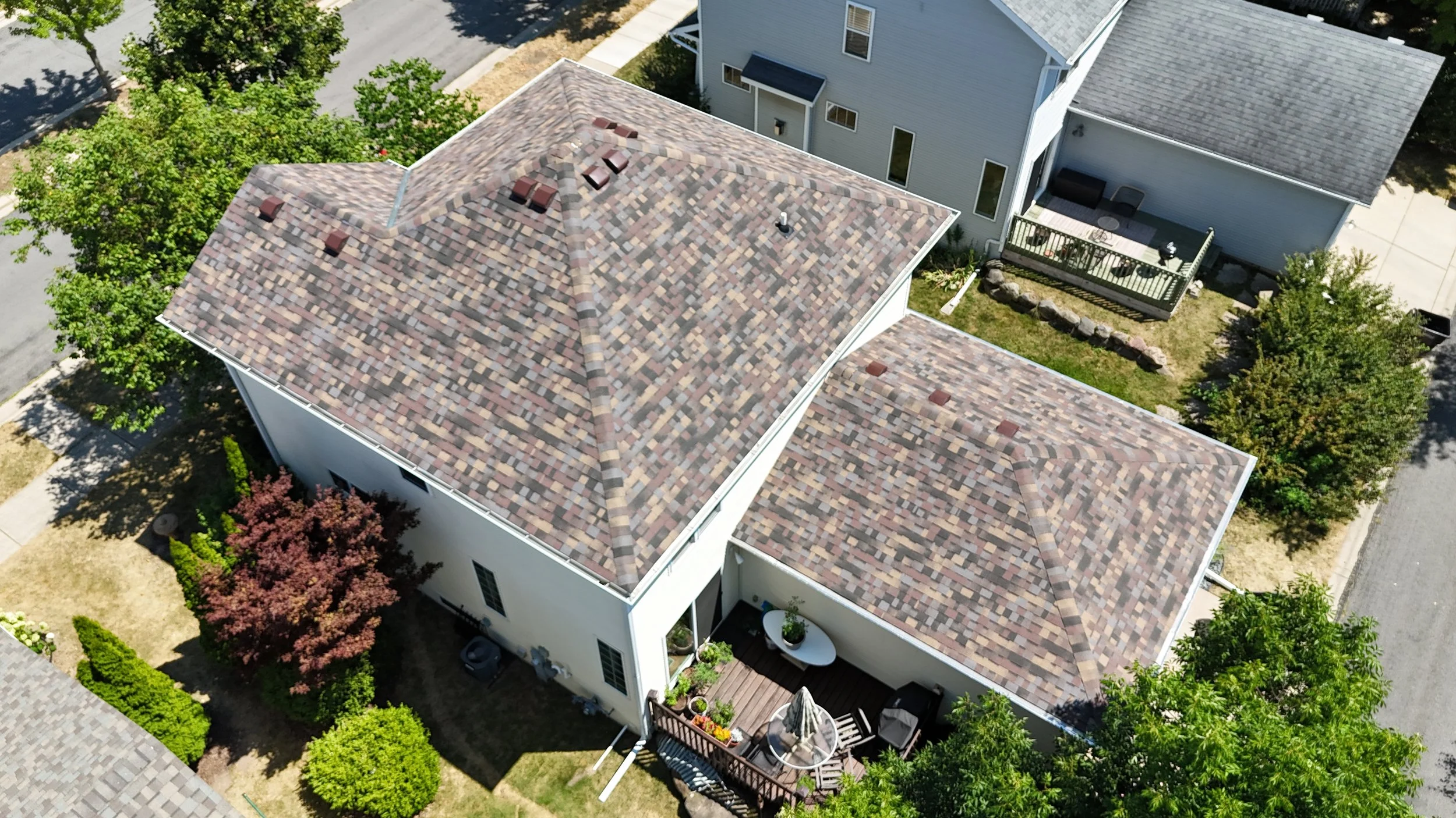 Aerial view of a residential home with Owens Corning Duration Flex Summer Harvest shingles.