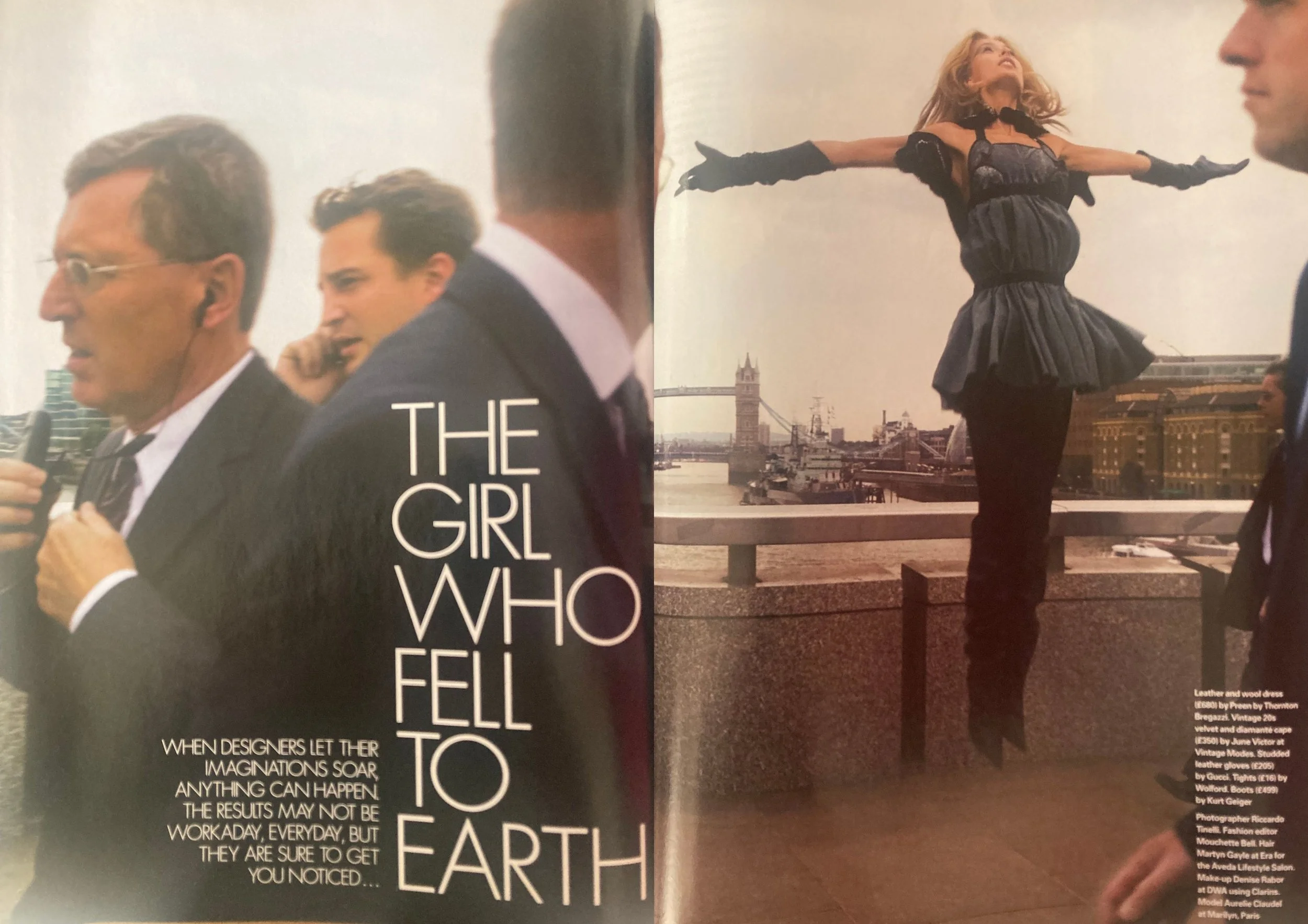 Double page fashion editorial from ELLE UK December 2003 showing a white woman with long blonde hair wearing a blue ruffled top on the right with black tights and black boots jumping in the air.