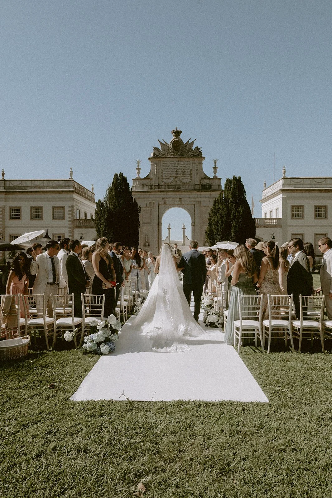 The aisle on the lawn, toward the arch