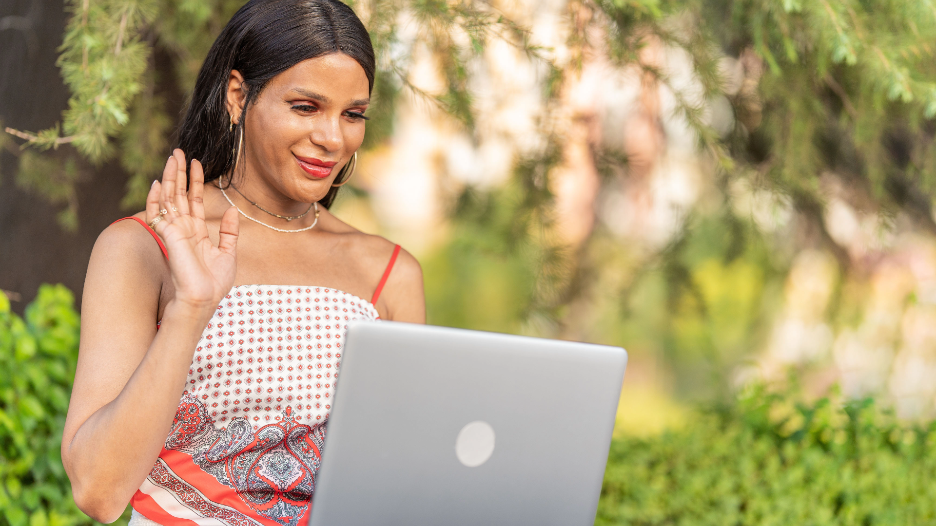 A person having a virtual therapy consultation on their laptop