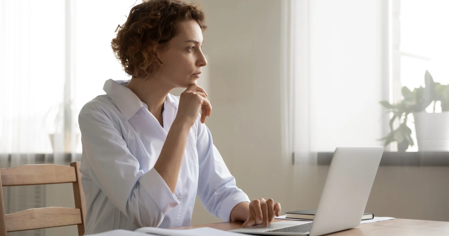 A person sitting at their computer during a therapy session