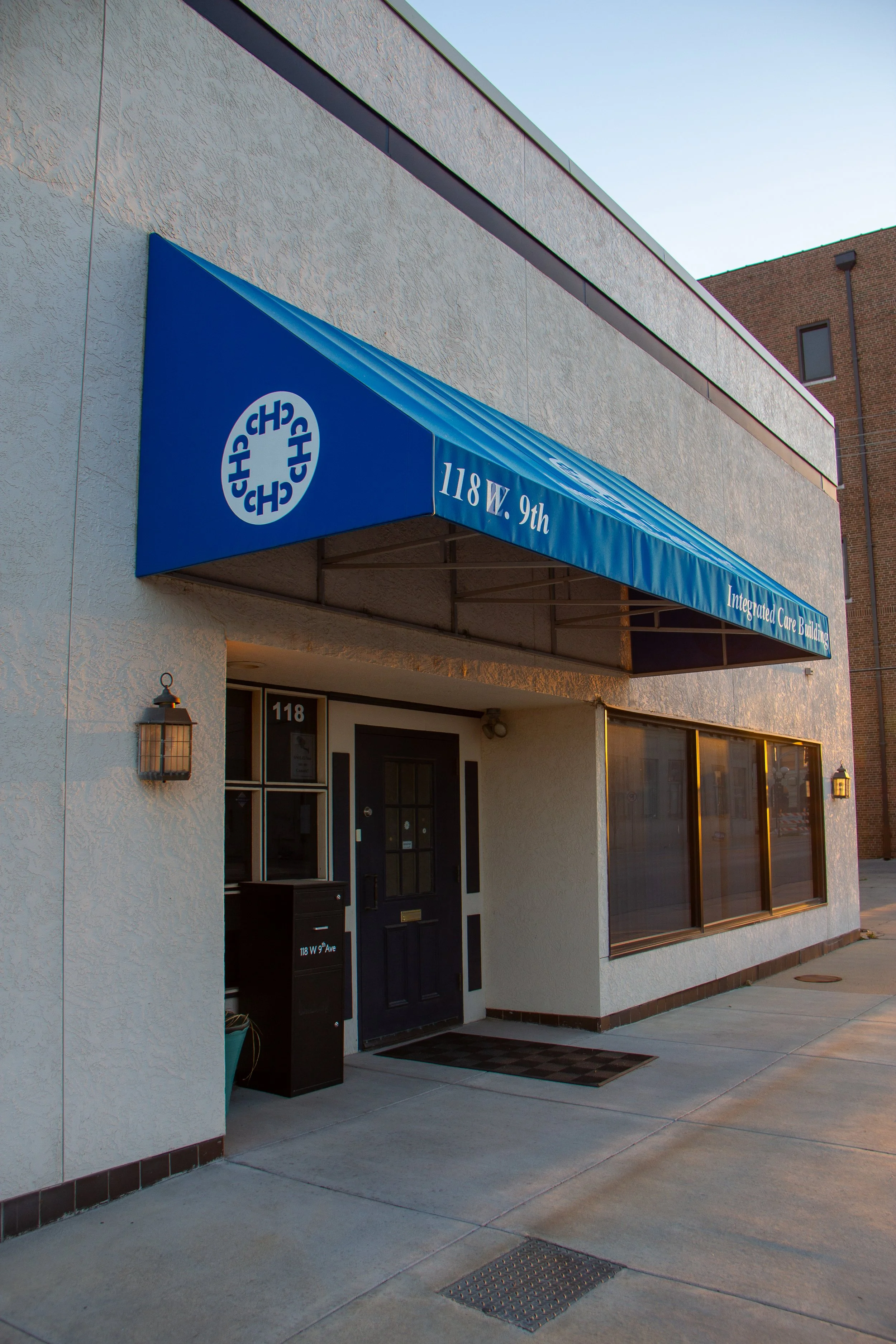 Building with a blue awning over the entrance that reads 'Integrated Care Building'.